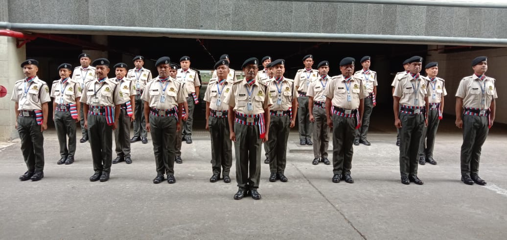 Large formation of SUN SECURITY SERVICES officers in ceremonial formation